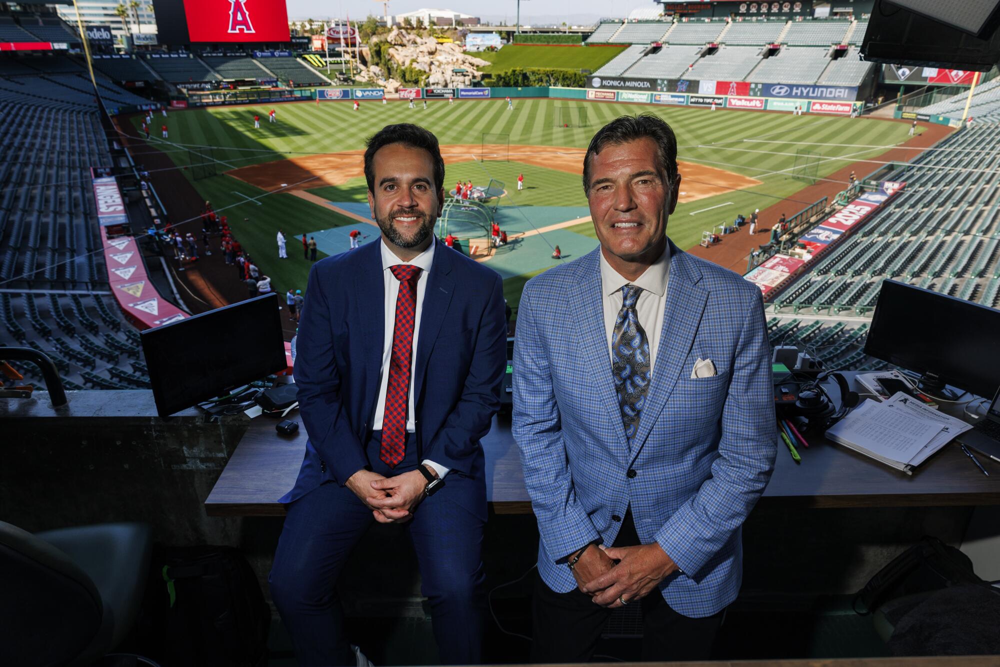 Angels broadcasters Wayne Randazzo, left and Mark Gubicza in their broadcast booth at Angel Stadium.