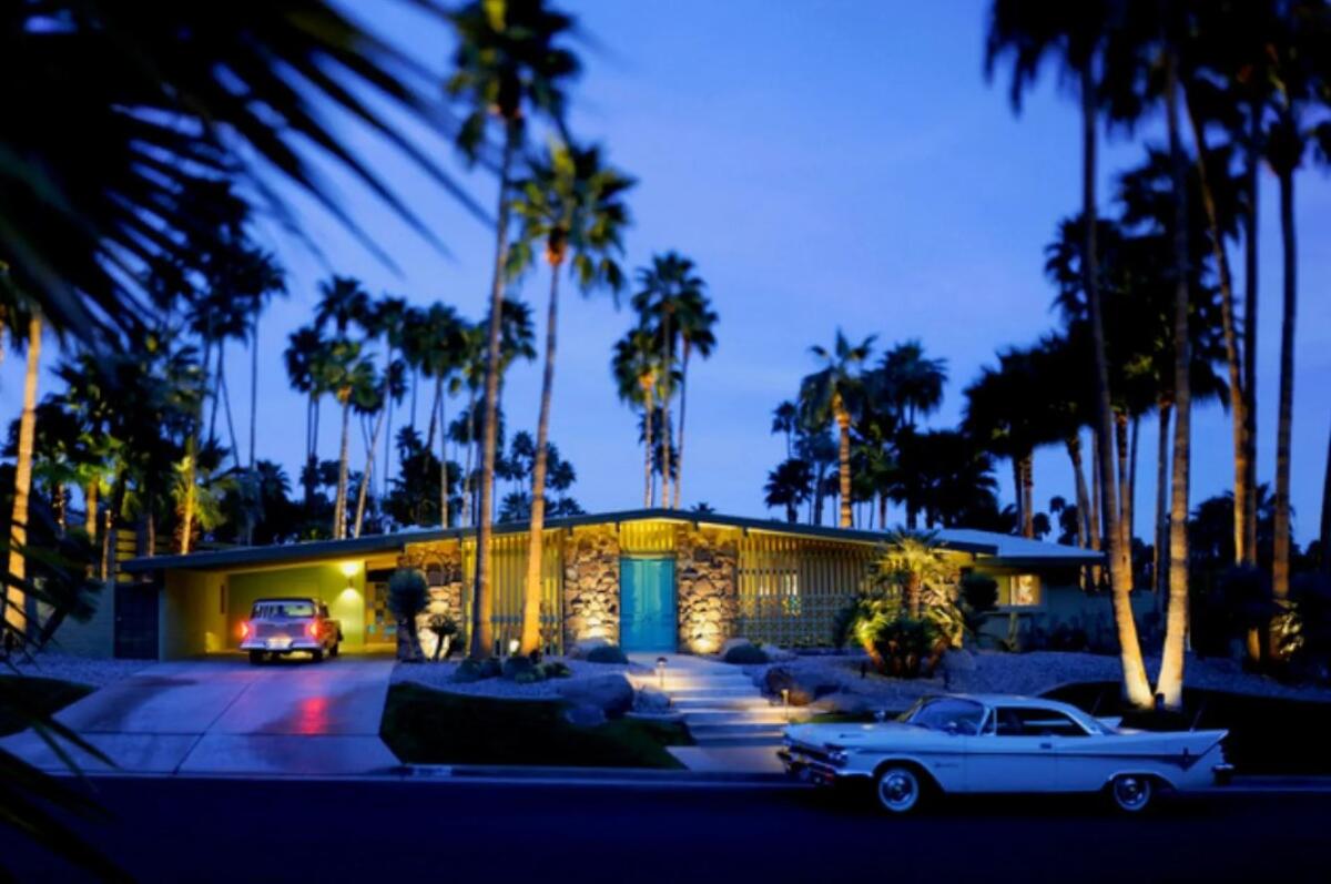 A 1962 Midcentury Modern home in Palm Springs at dusk.