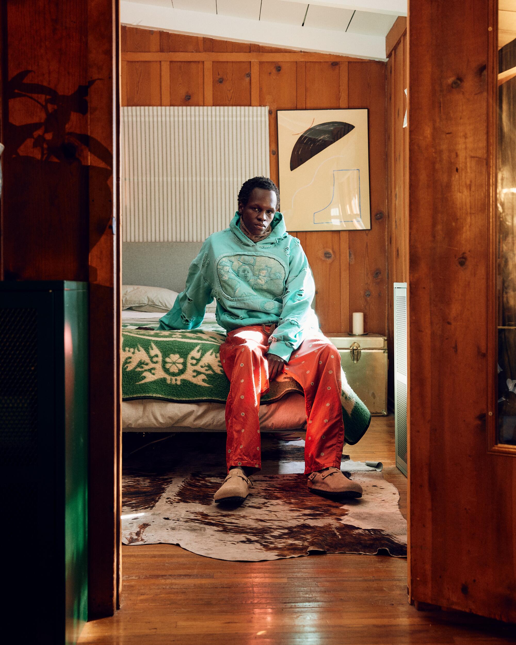 Bryan Nelson Gonzalez hoodie, ERL Turtleneck, Kapital Silk Pants.