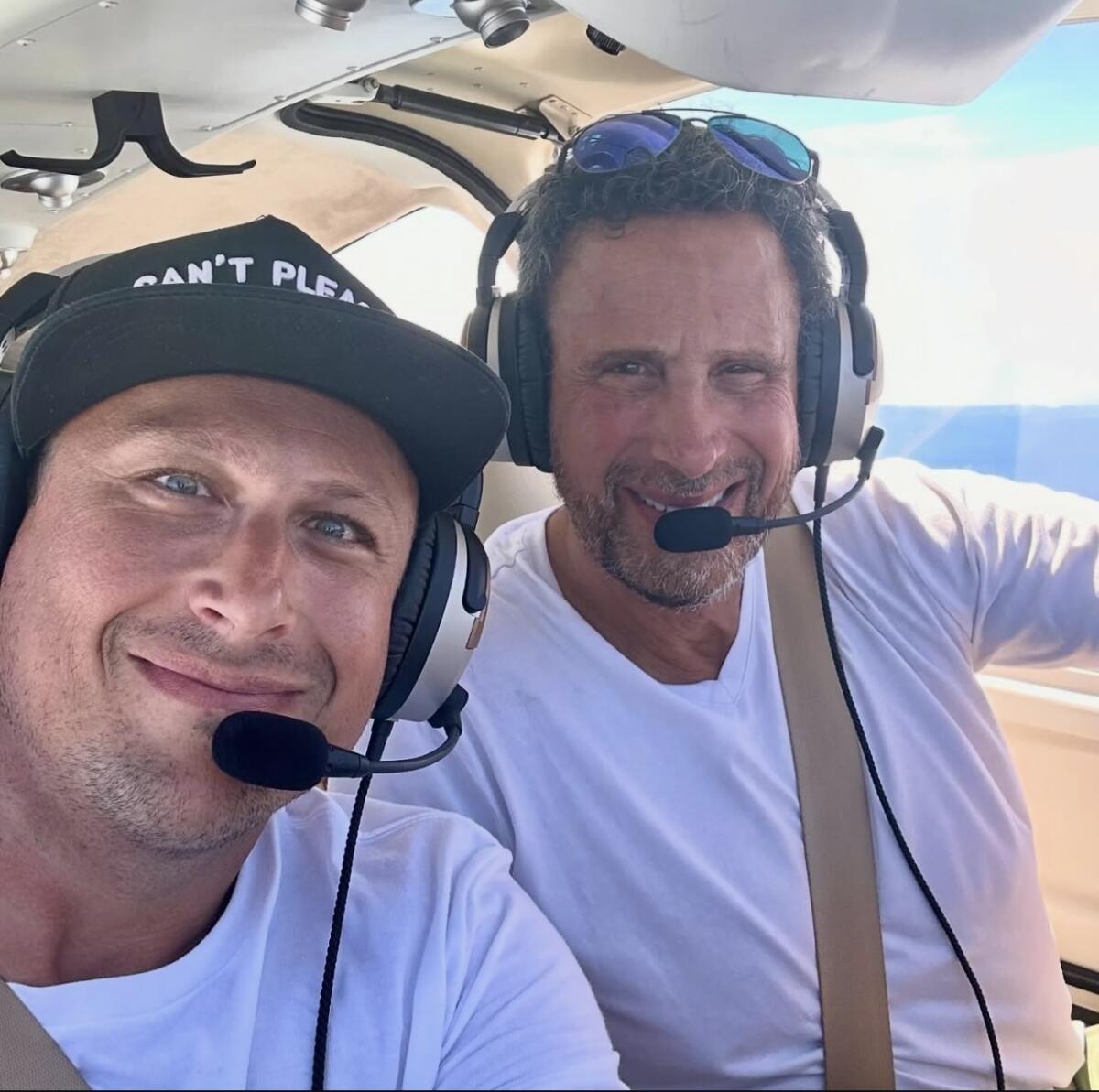 Matthew Berkovitz in a cockpit with Paul Berkovitz