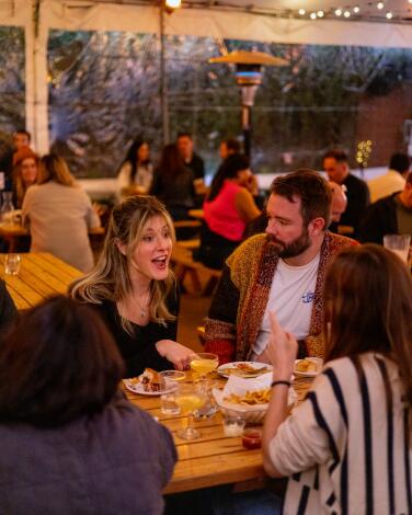 Diners on the outdoor patio at Everson Royce Bar.