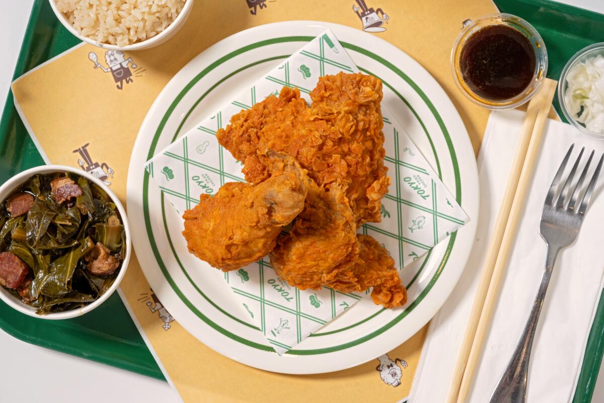 LOS ANGELES, CA - OCTOBER 29, 2024: a 3 piece chicken plate with sides of rice and collard greens at Tokyo Fried Chicken in downtown Los Angeles. (Ron De Angelis / For The Times)