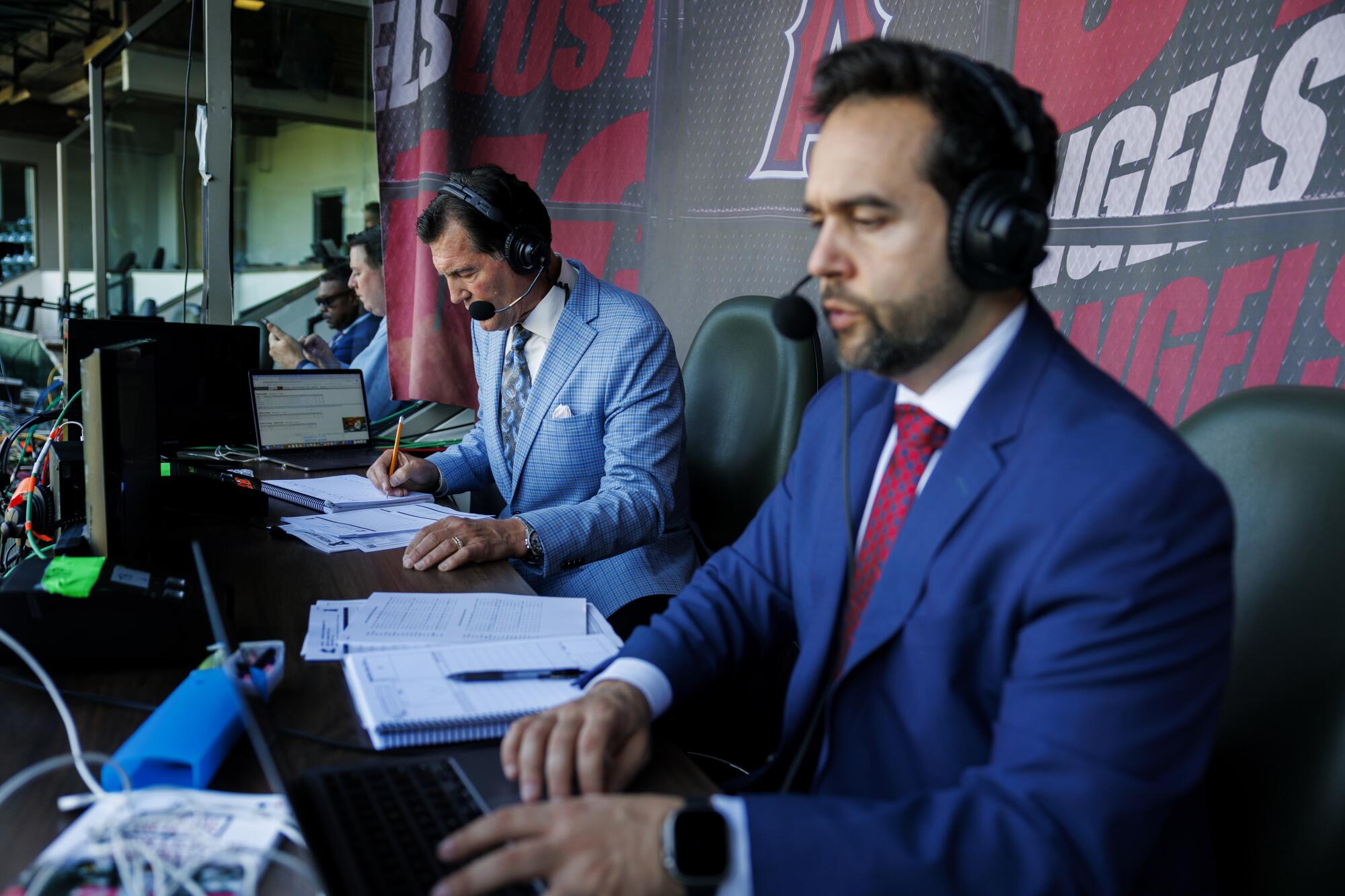 Angels broadcasters Mark Gubicza, left, and Wayne Randazzo prepare for a game against the Miami Marlins on May 24.