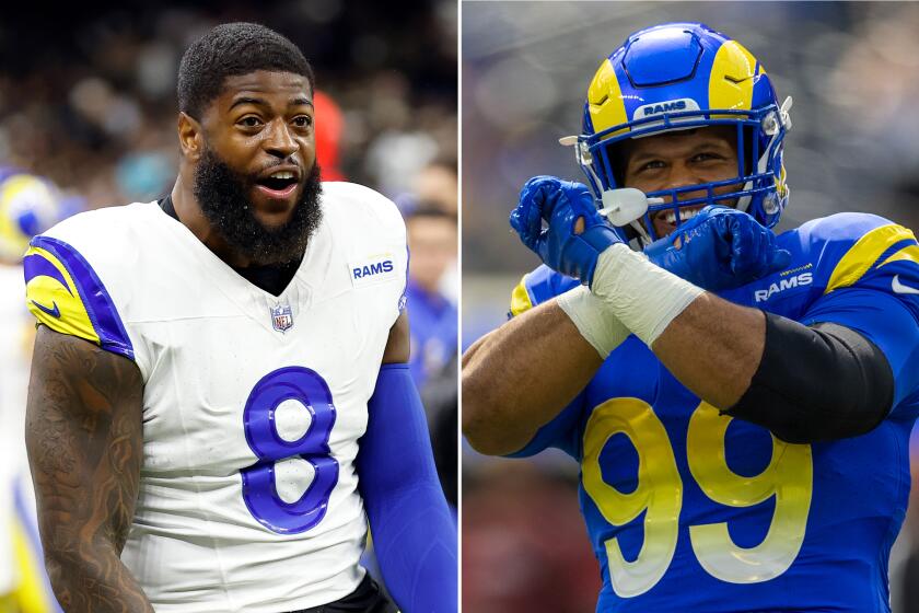 Rams linebacker Jared Verse, left, and former Rams defensive lineman Aaron Donald.