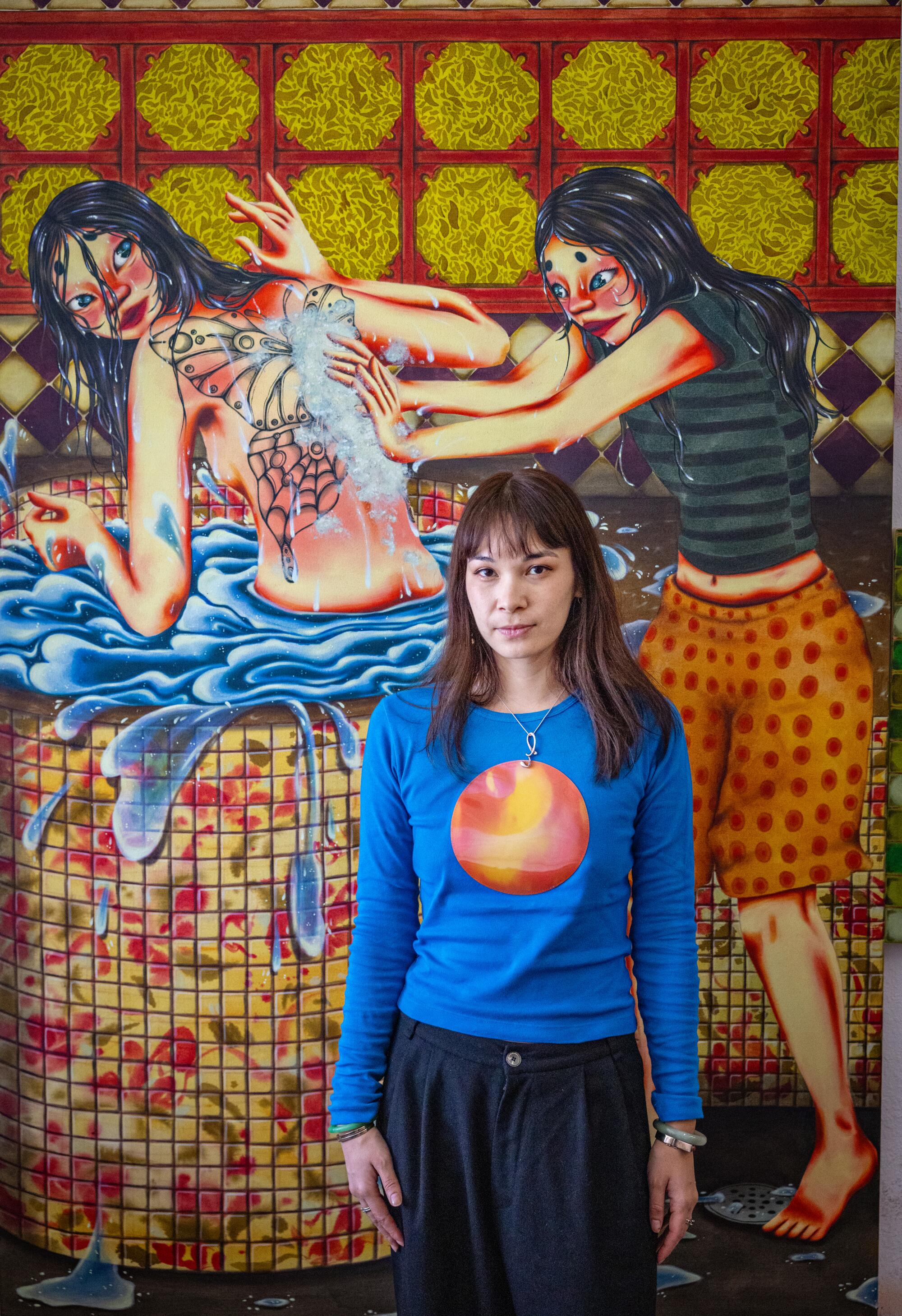 Zoé Blue M. in front of her painting “Butterfly.”