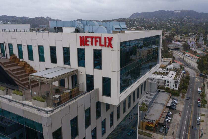 Signage outside Netflix Inc. headquarters on Sunset Boulevard in Los Angeles, California, U.S. on Tuesday, April 13, 2021. ArcLight Cinemas and Pacific Theatres, two California movie-theater chains that are part of the same company, announced plans to close permanently, underscoring the still-tenuous state of the industry. Photographer: Bing Guan/Bloomberg