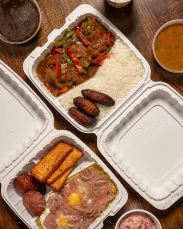 LOS ANGELES, CA - OCTOBER 27, 2024: Mangu Con Tres Golpes and Santana's Chicken with sides (Ensalada Rusa and Red and Black Beans) at El Bacano in North Hollywood (Ron De Angelis / For The Times)