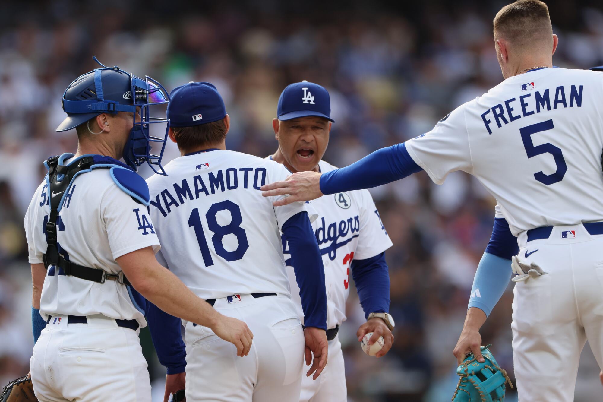 Dodgers manager Dave Roberts pulls starting pitcher Yoshinobu Yamamoto from the game.