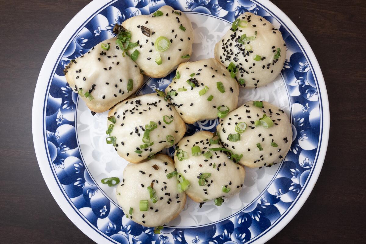 ALHAMBRA, CA - OCTOBER 09: Shanghai pan fried small bao (sheng jian bao) at Kang Kang Food Court in Alhambra, CA on Wednesday, Oct. 9, 2024. (Myung J. Chun / Los Angeles Times)